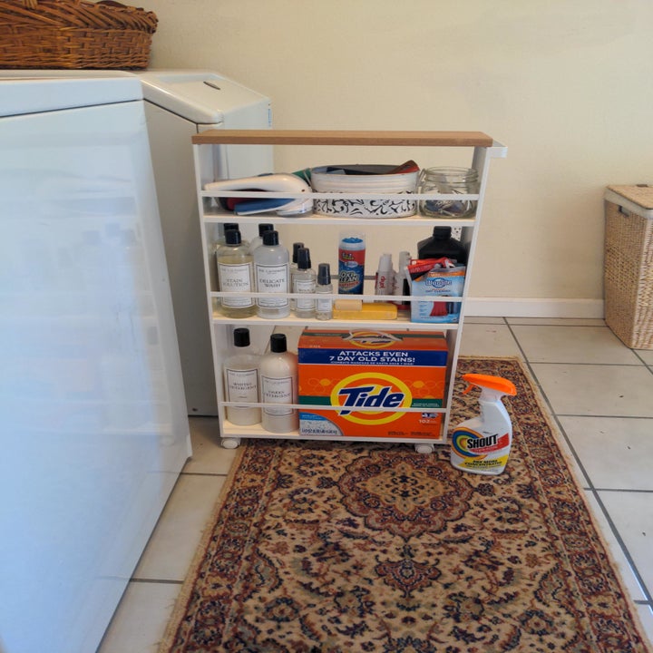 the tower pulled out to reveal all of the reviewer's detergent and laundry products