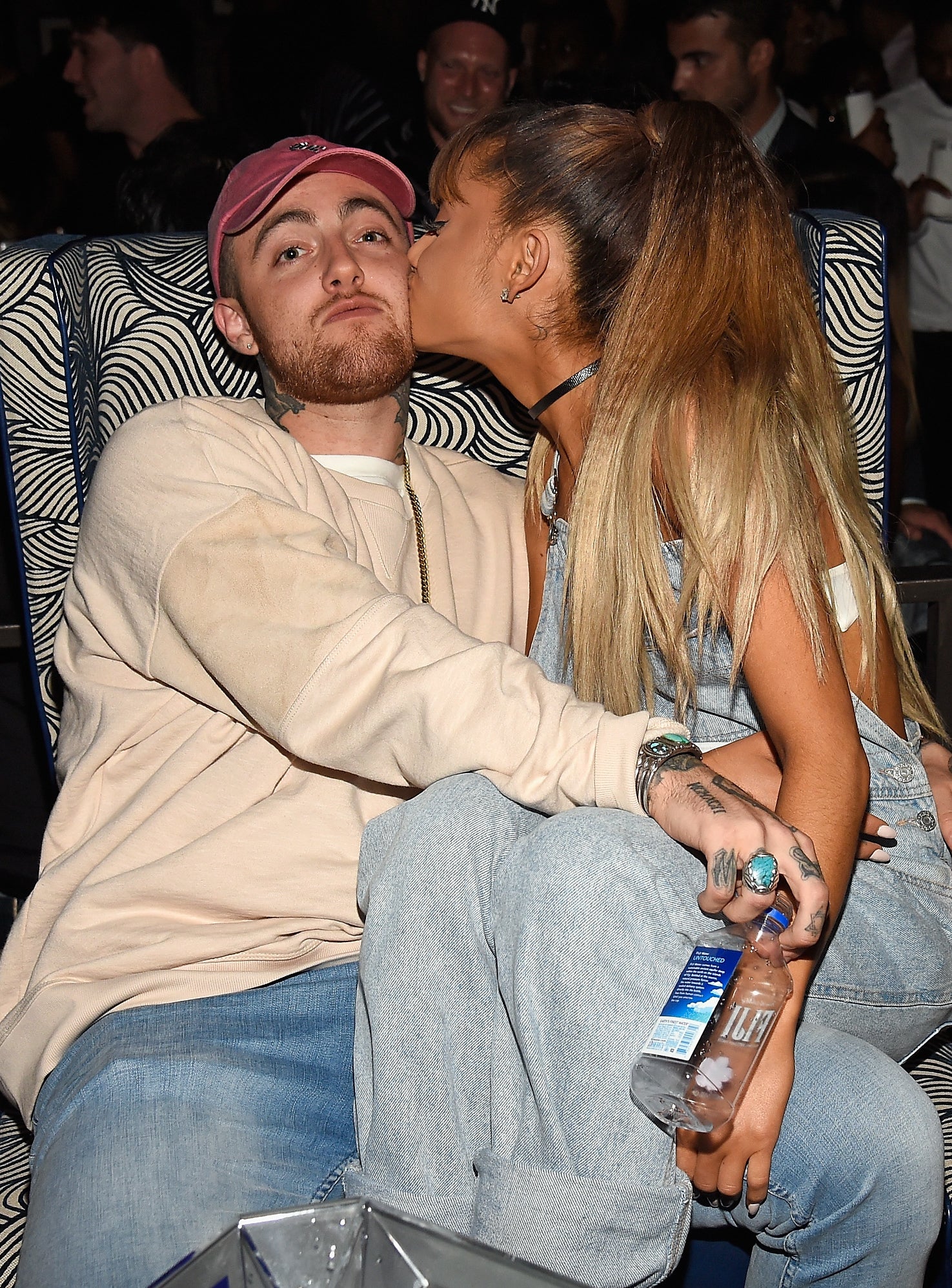 Closeup of Mac and Ariana with the singer sitting on Mac&#x27;s lap