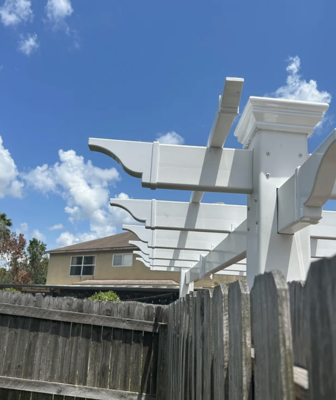 A pergola reaching over someone&#x27;s fence