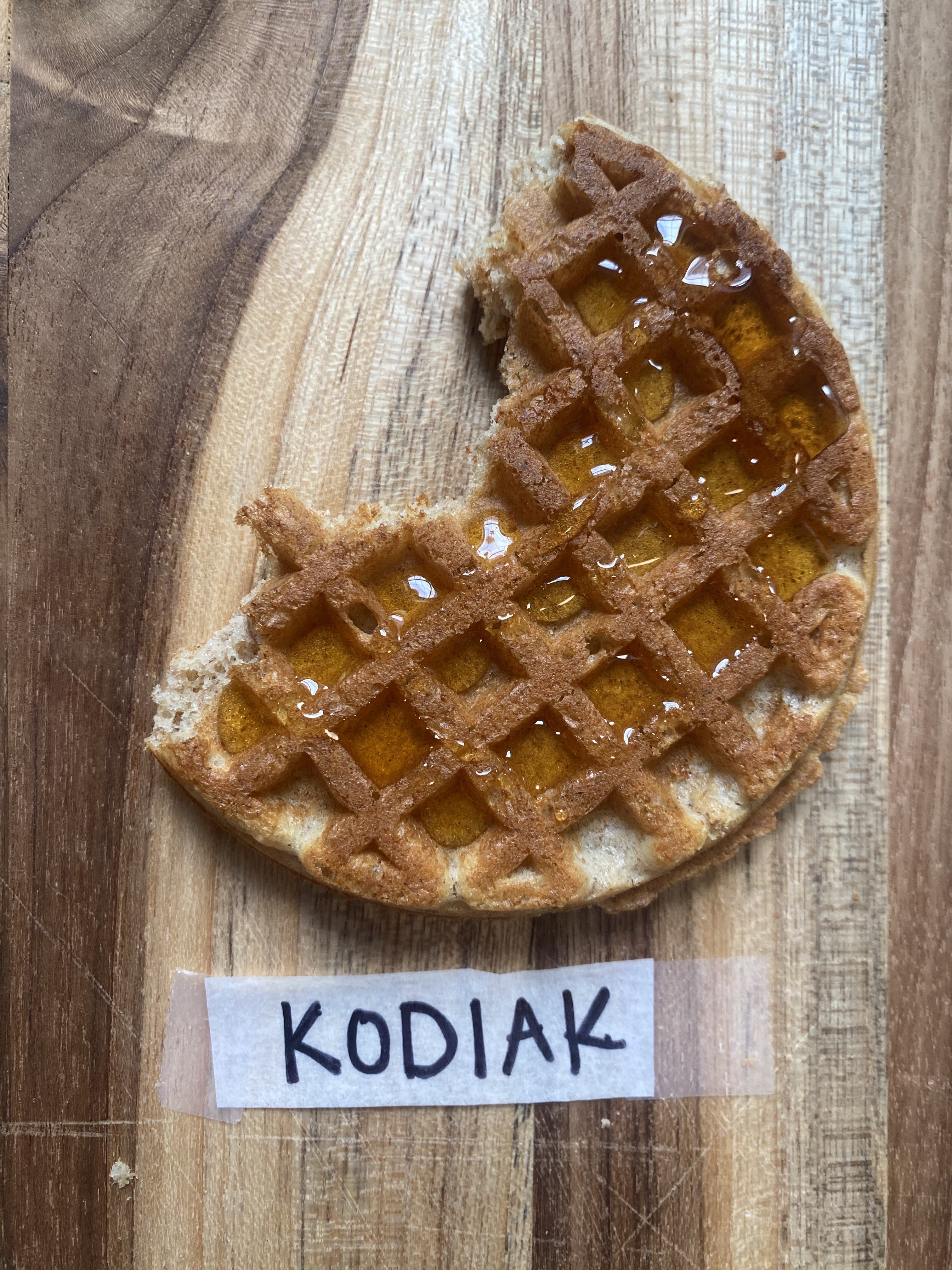 a kodiak waffle with syrup drizzled on