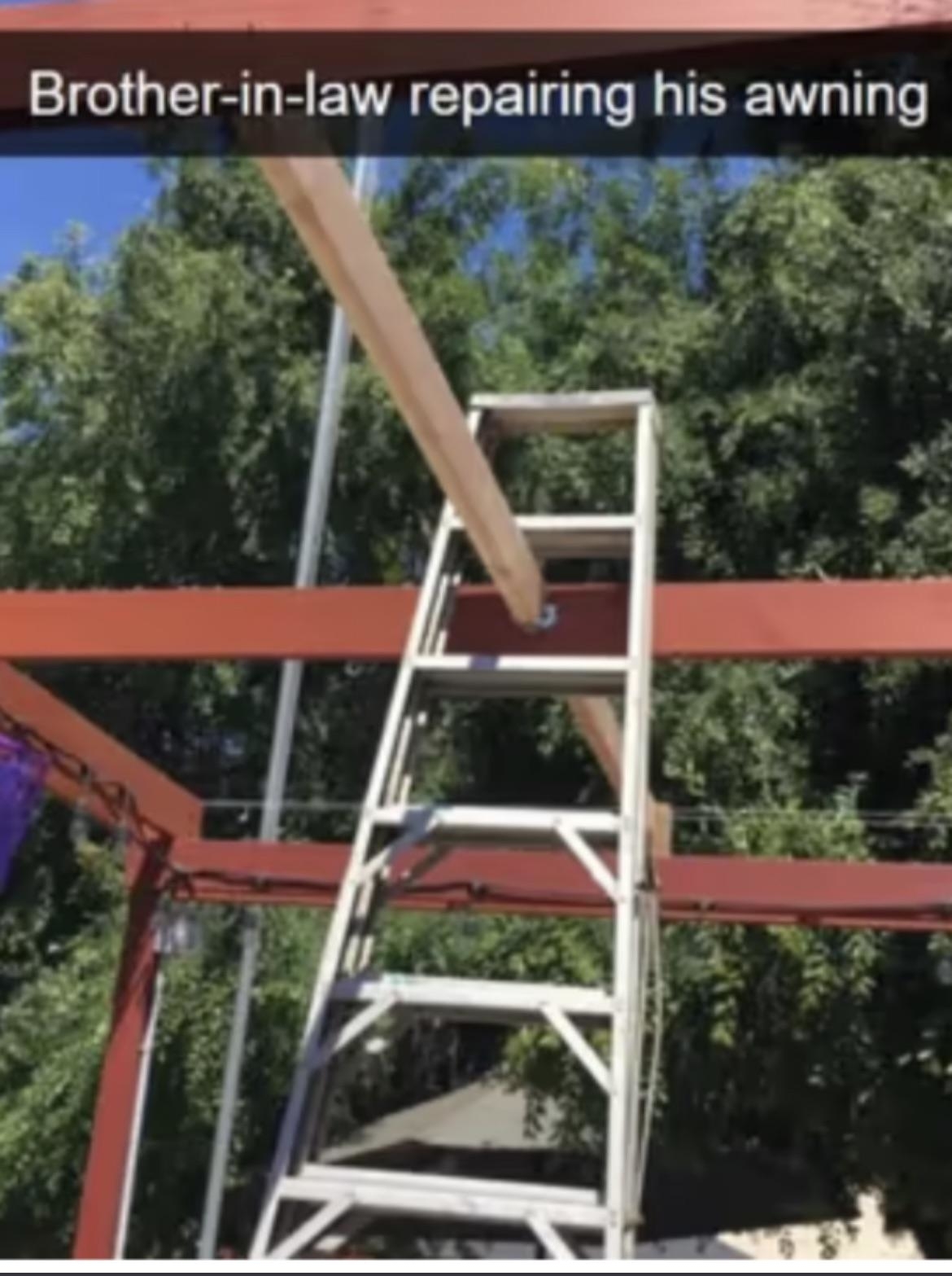 Wooden piece of awning goes right through the large ladder