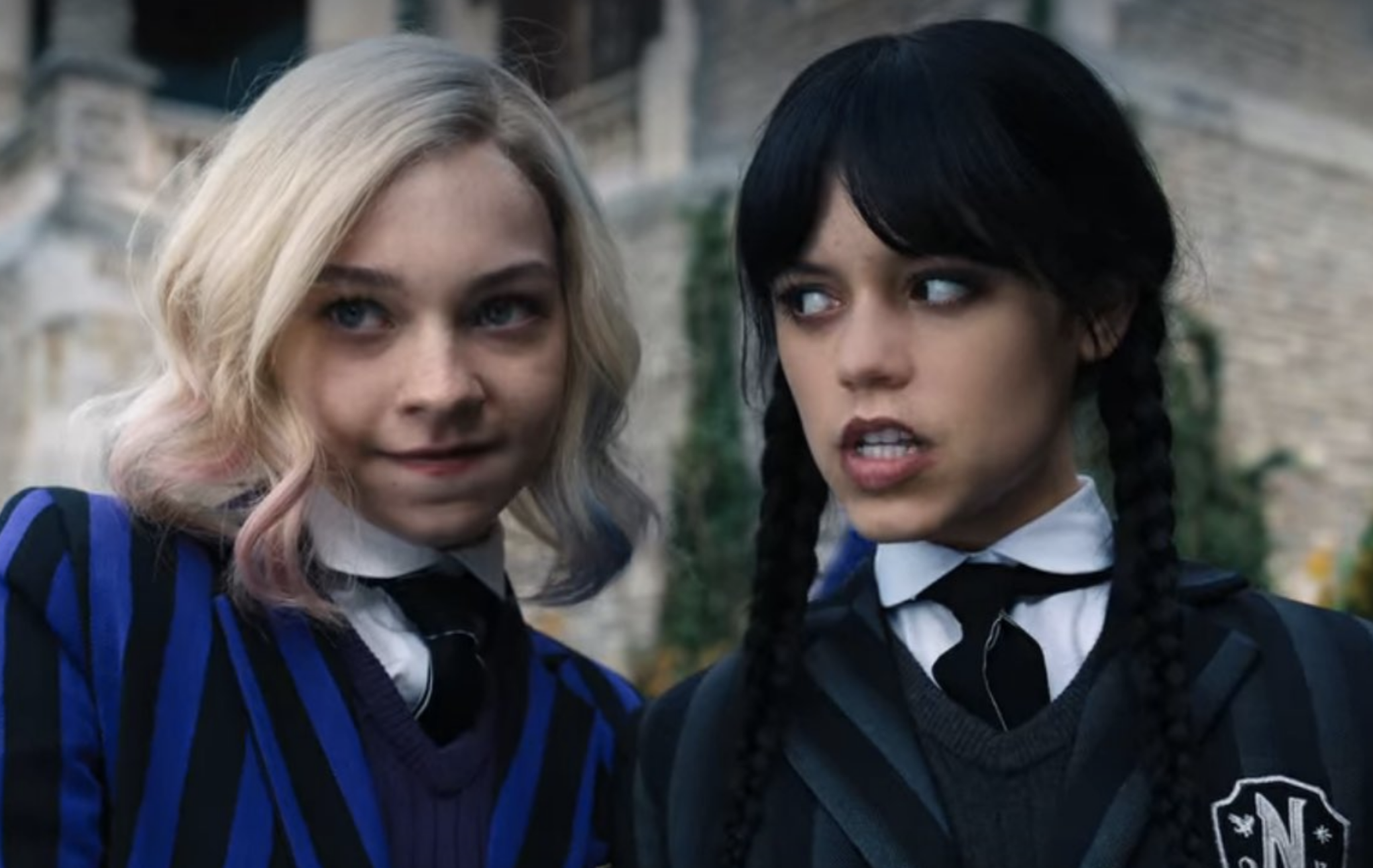 Enid and Wednesday on campus at Nevermore Academy.