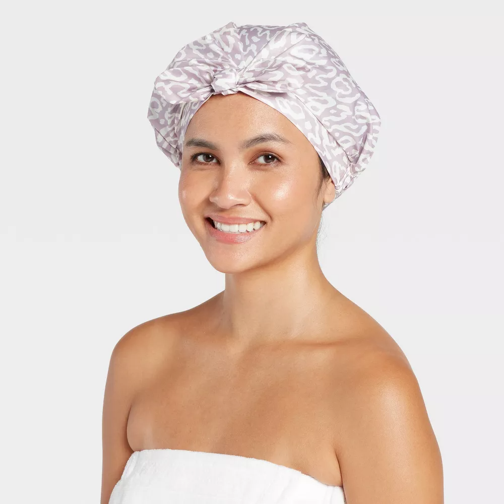 A woman wearing the shower cap