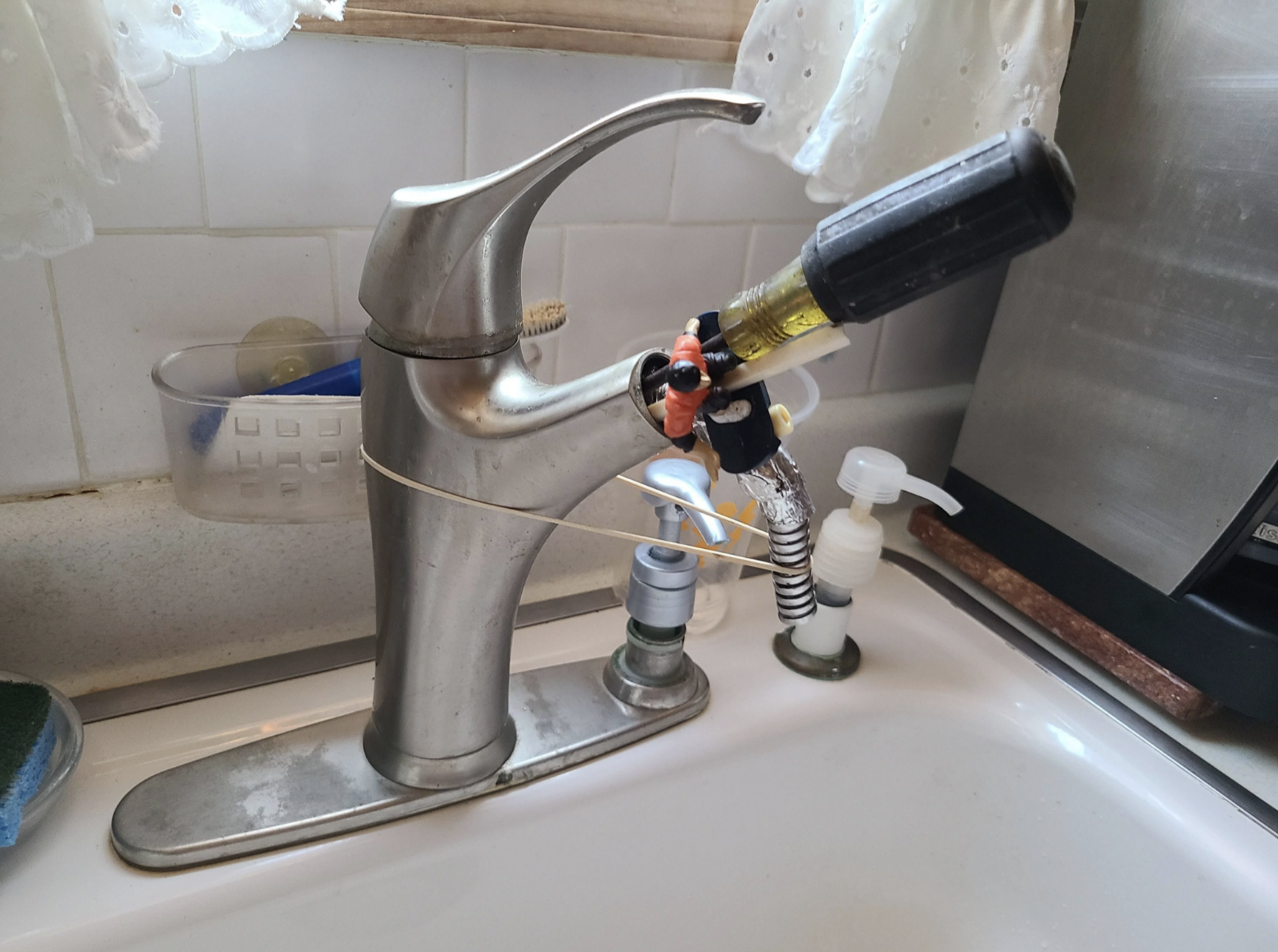 A screwdriver in the kitchen sink