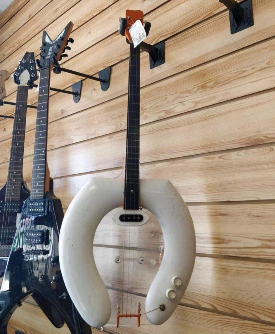 A guitar made out of a toilet seat