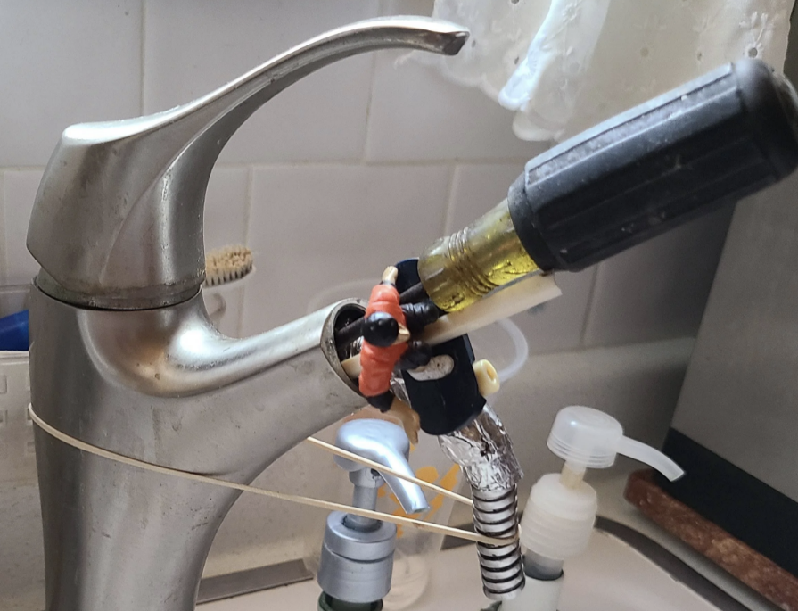 A screwdriver in a kitchen sink