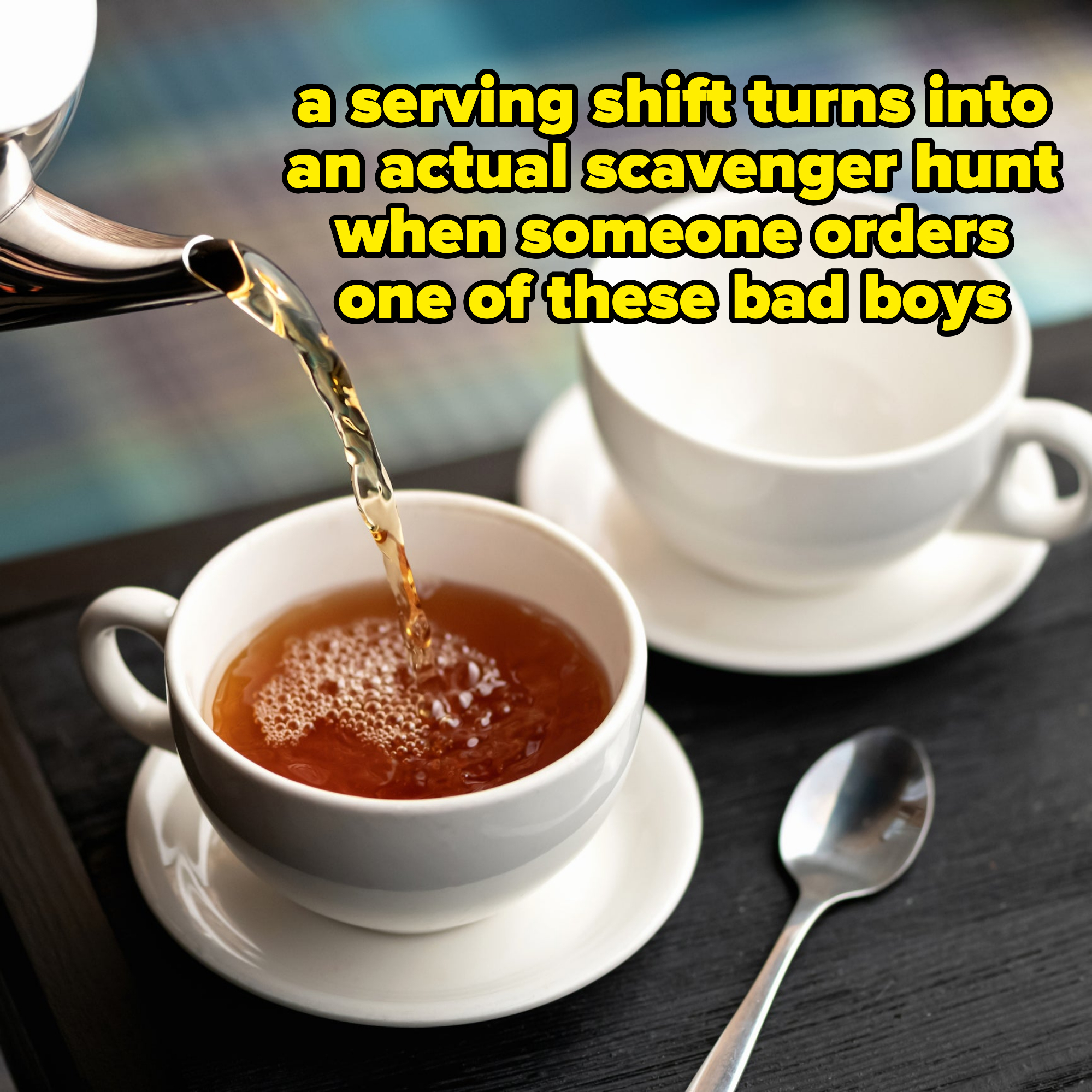 Someone pouring tea in a mug