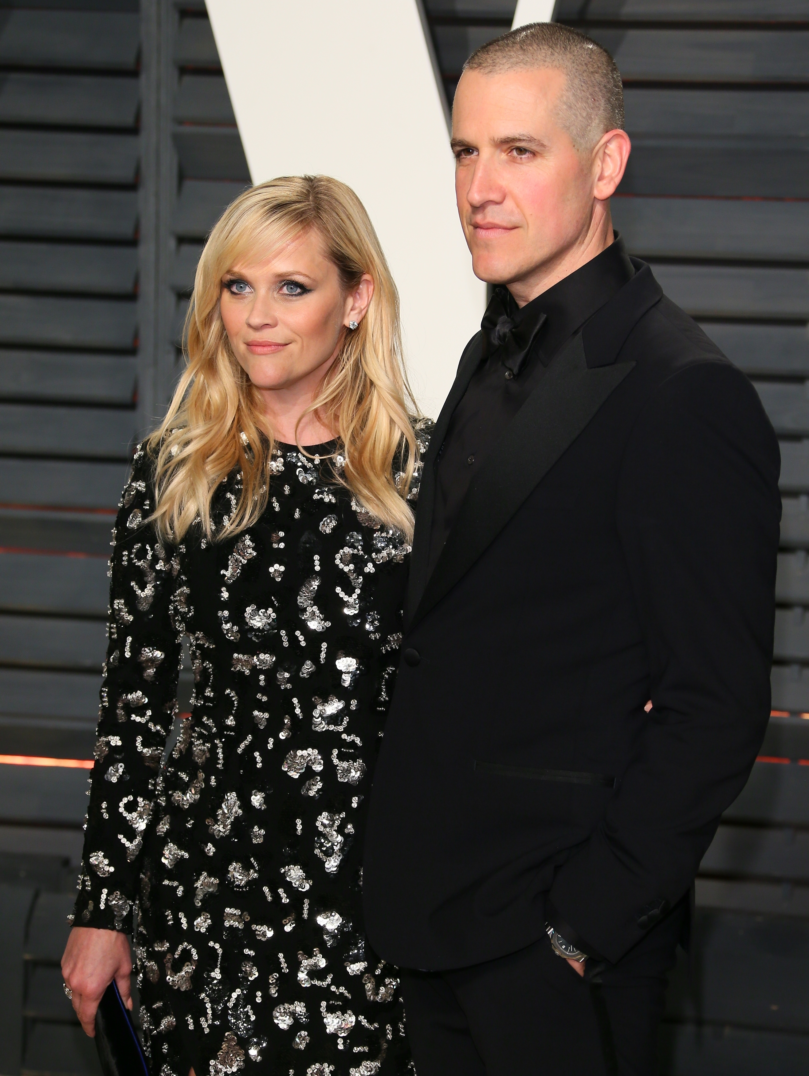 Close-up of Reese and Jim at a media event