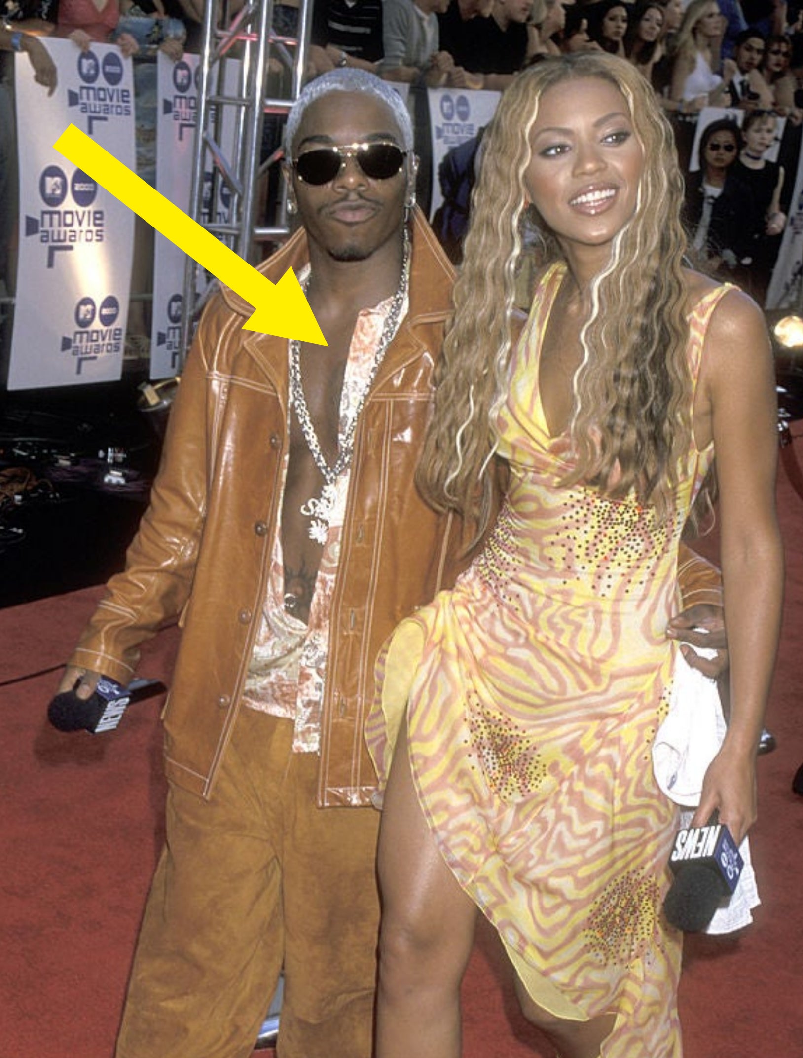 Sisqó and Beyoncé on the red carpet, with both wearing similar prints