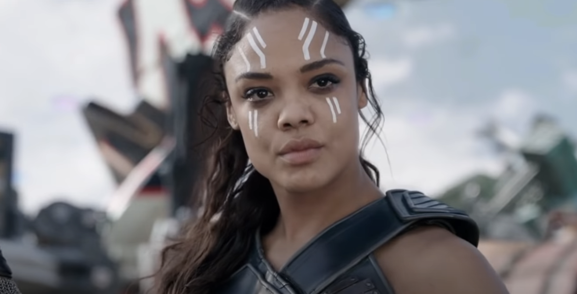 closeup of her character with paint on her face in battle
