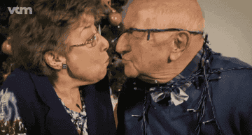An old couple kissing