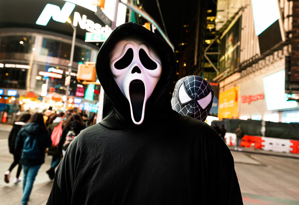 Person wearing a Ghostface mask