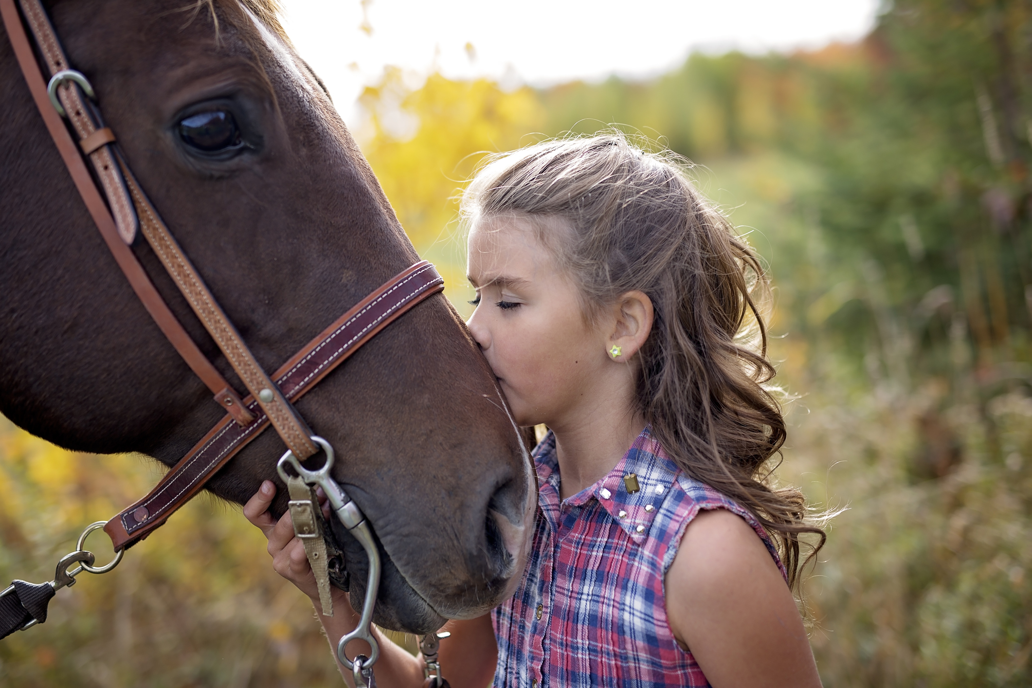 girl kissing horse