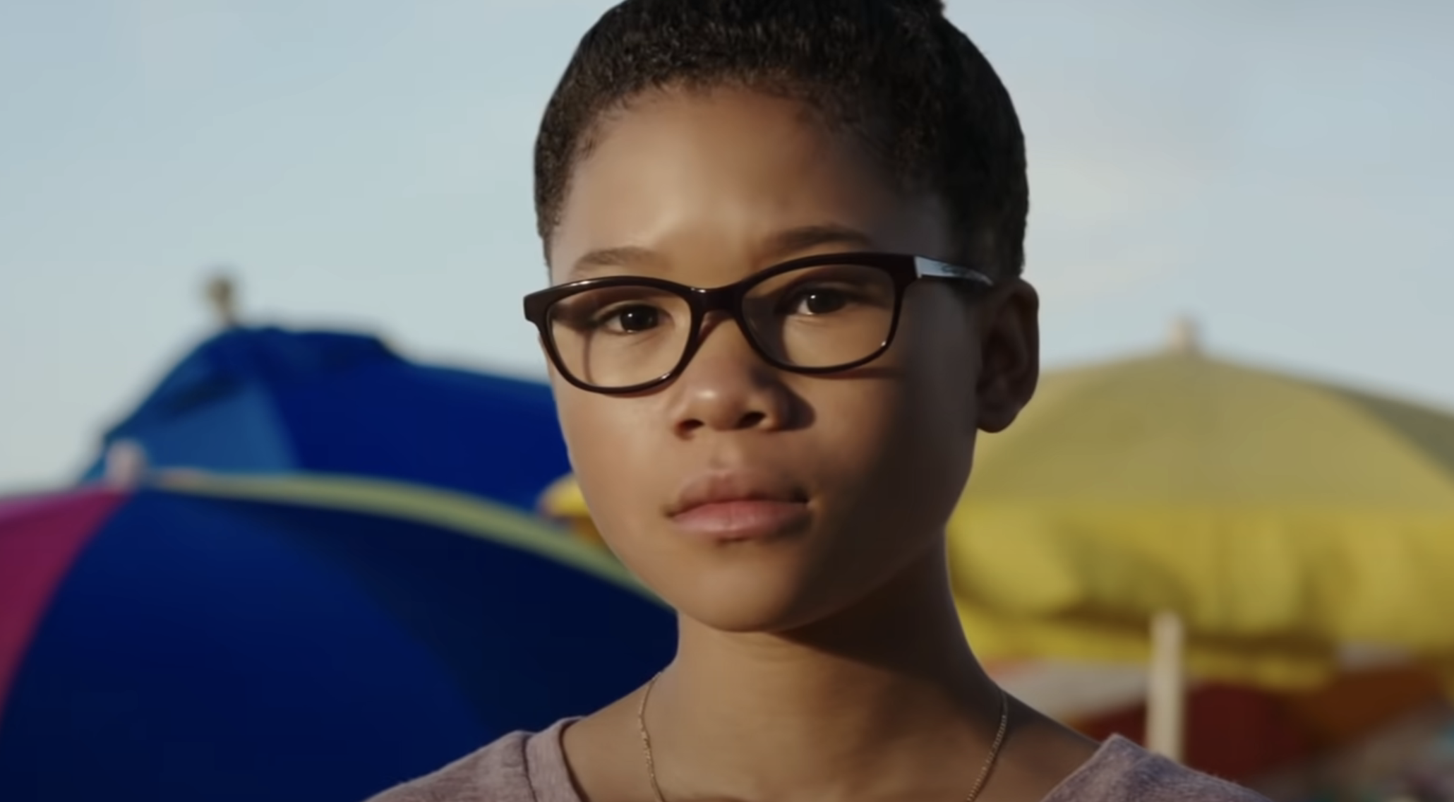 young storm in the film wearing glasses