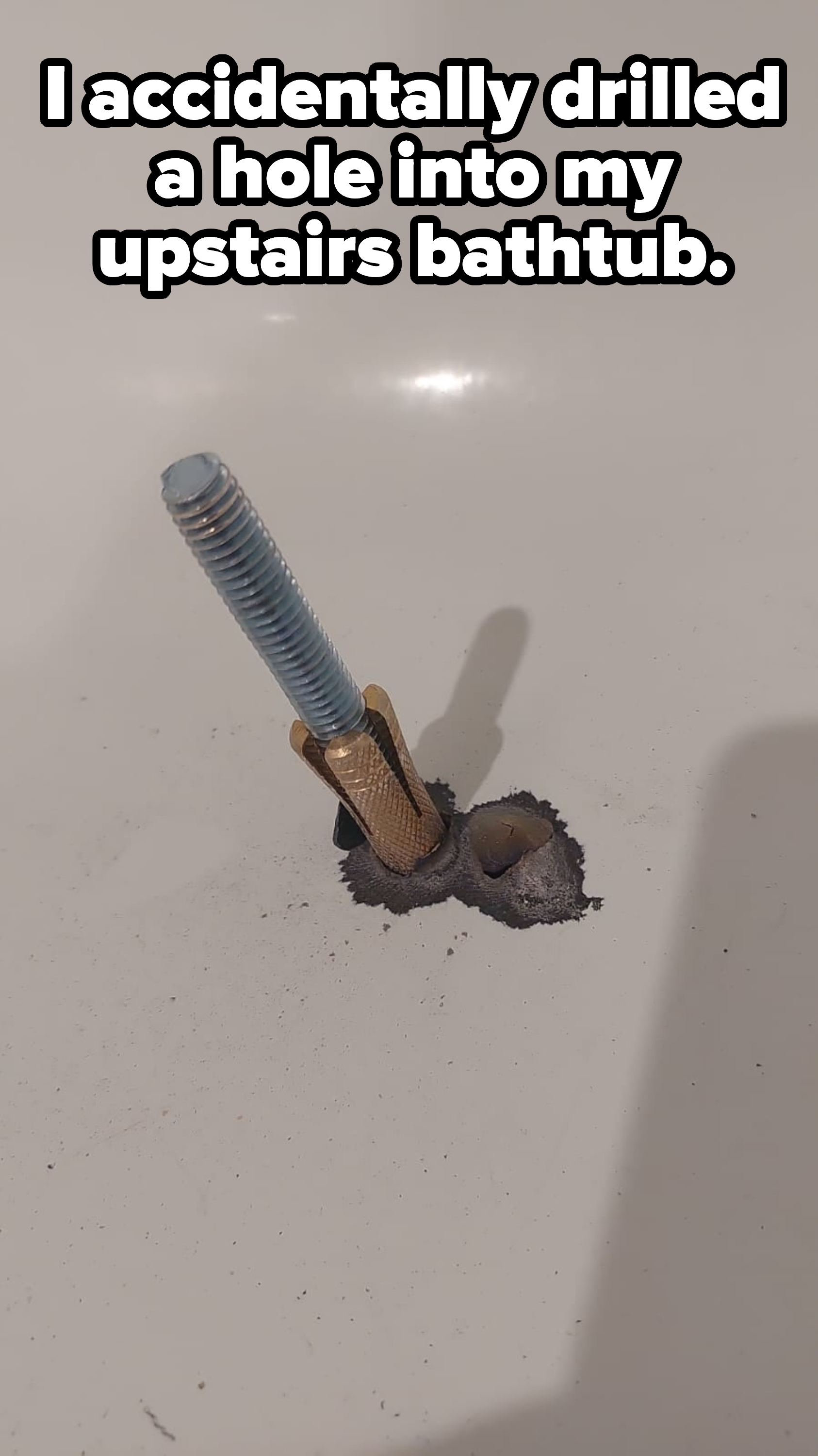 Person accidentally drills a hole through their upstairs bathtub