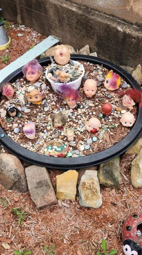 Doll heads in a garden