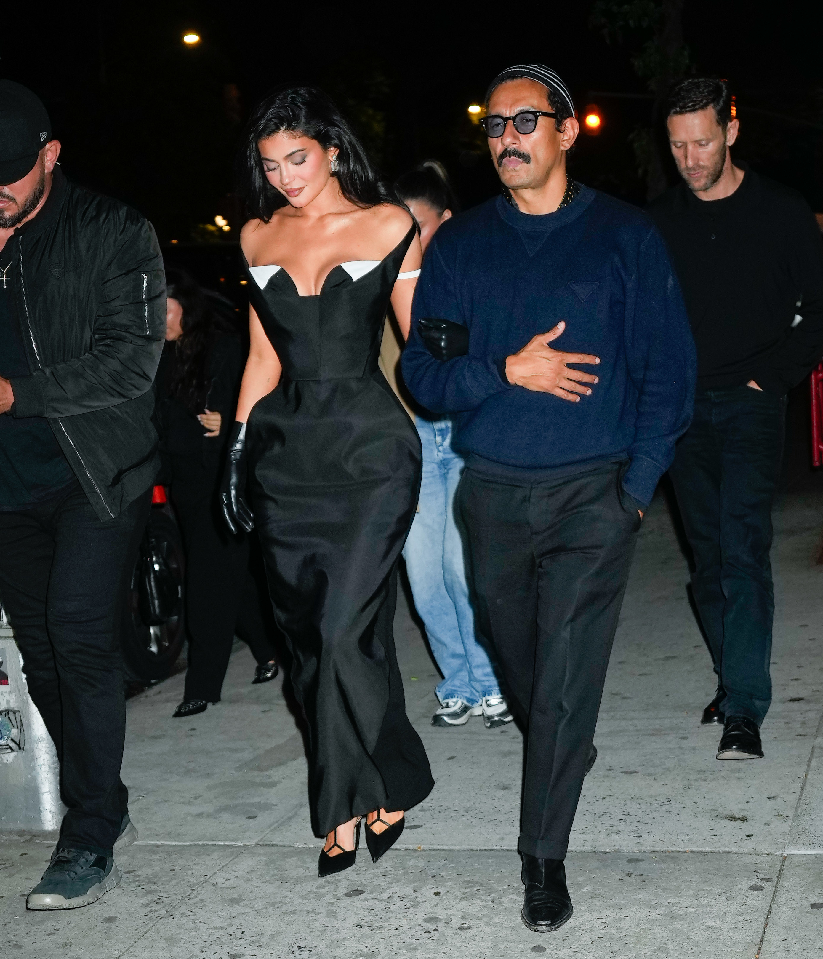 Kylie being escorted