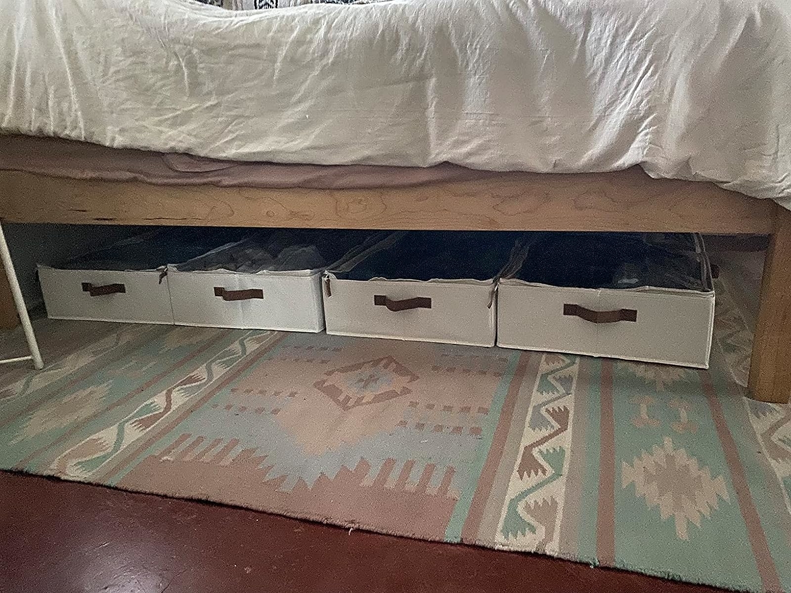 Reviewer image of four storage boxes under their bed