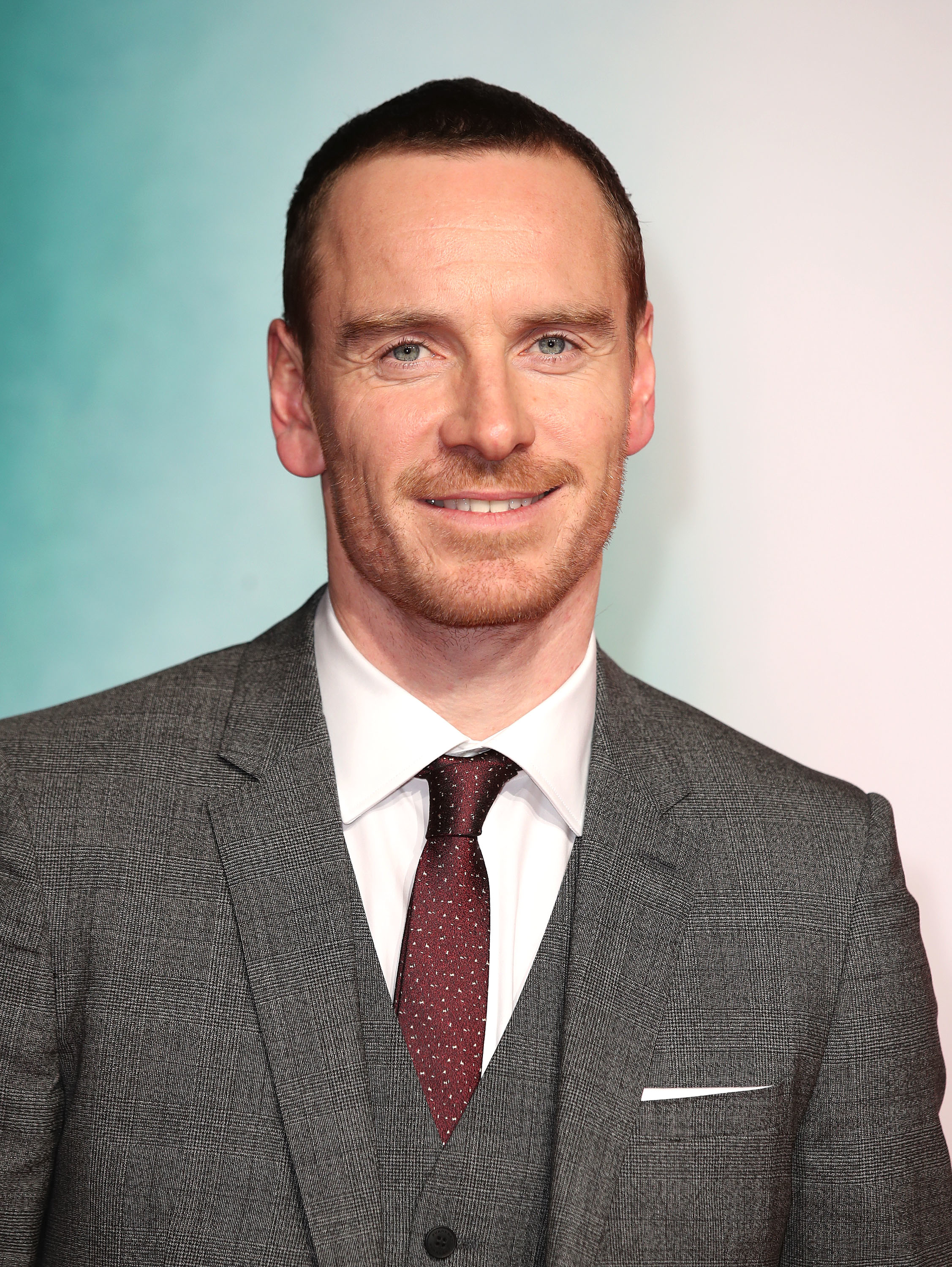 Close-up of Michael in a suit and tie at a media event