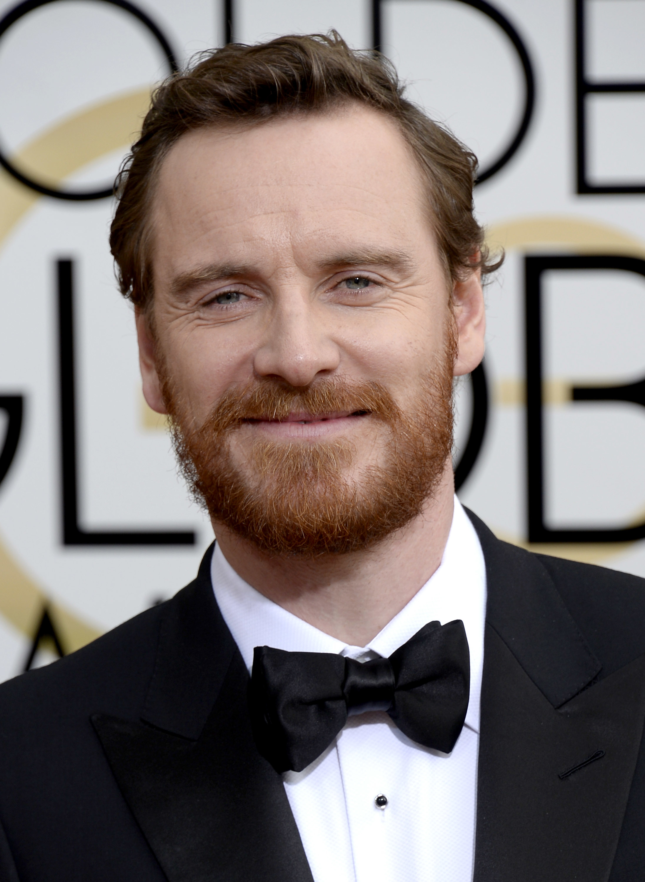 Close-up of Michael smiling in a bow tie