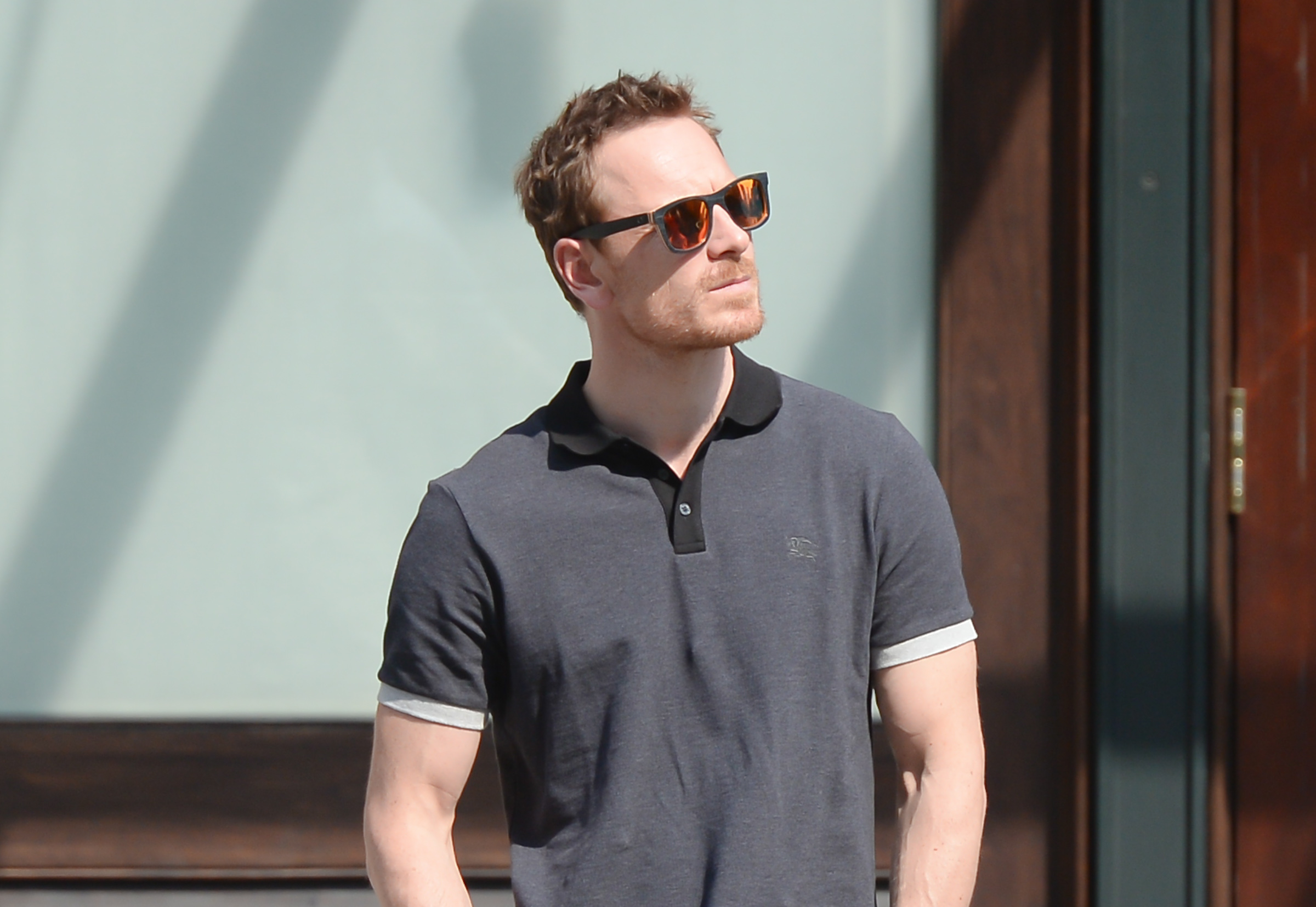 Close-up of Michael wearing sunglasses and a short-sleeved shirt
