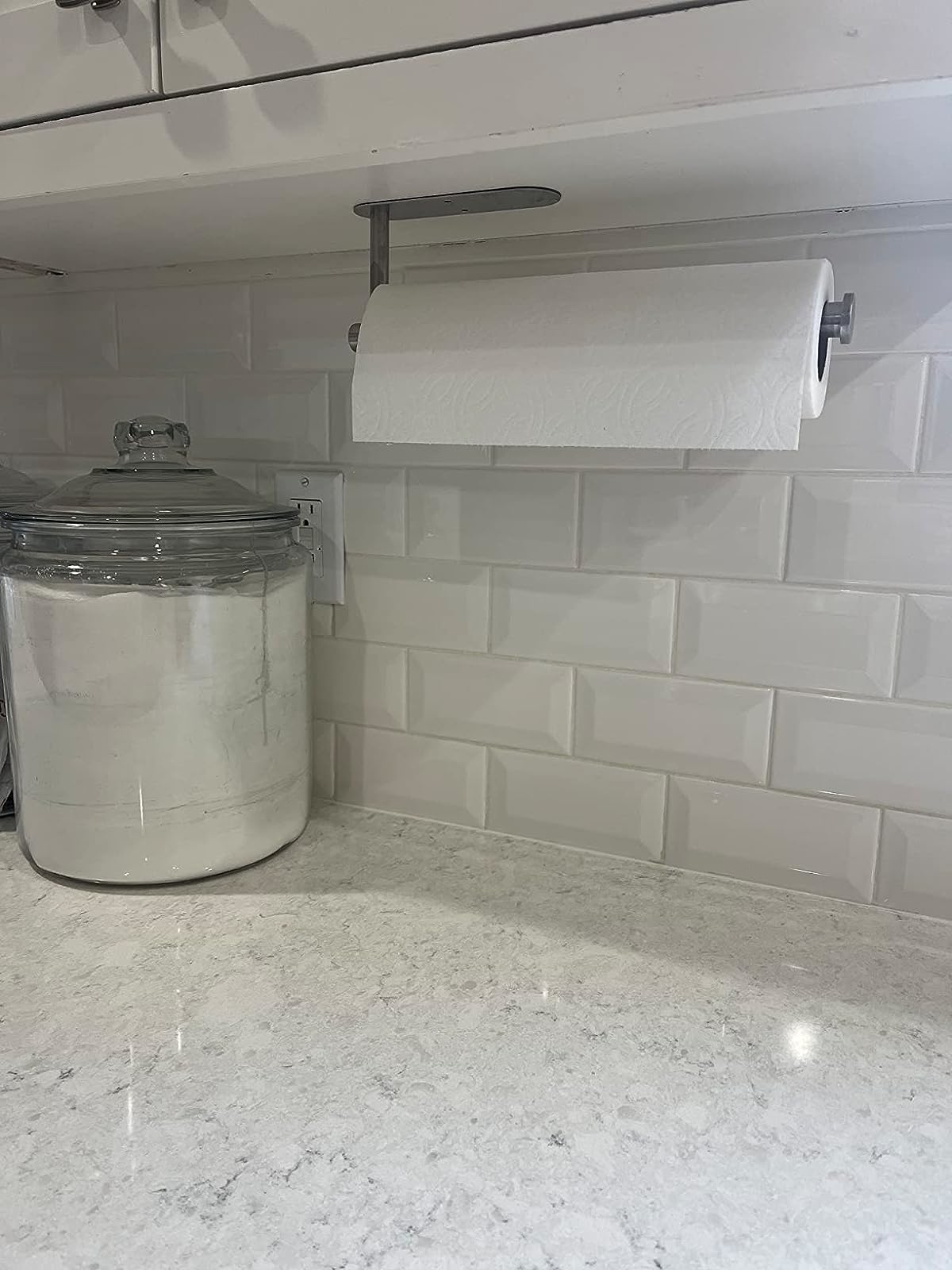 Reviewer image of paper towels on holder in a white kitchen