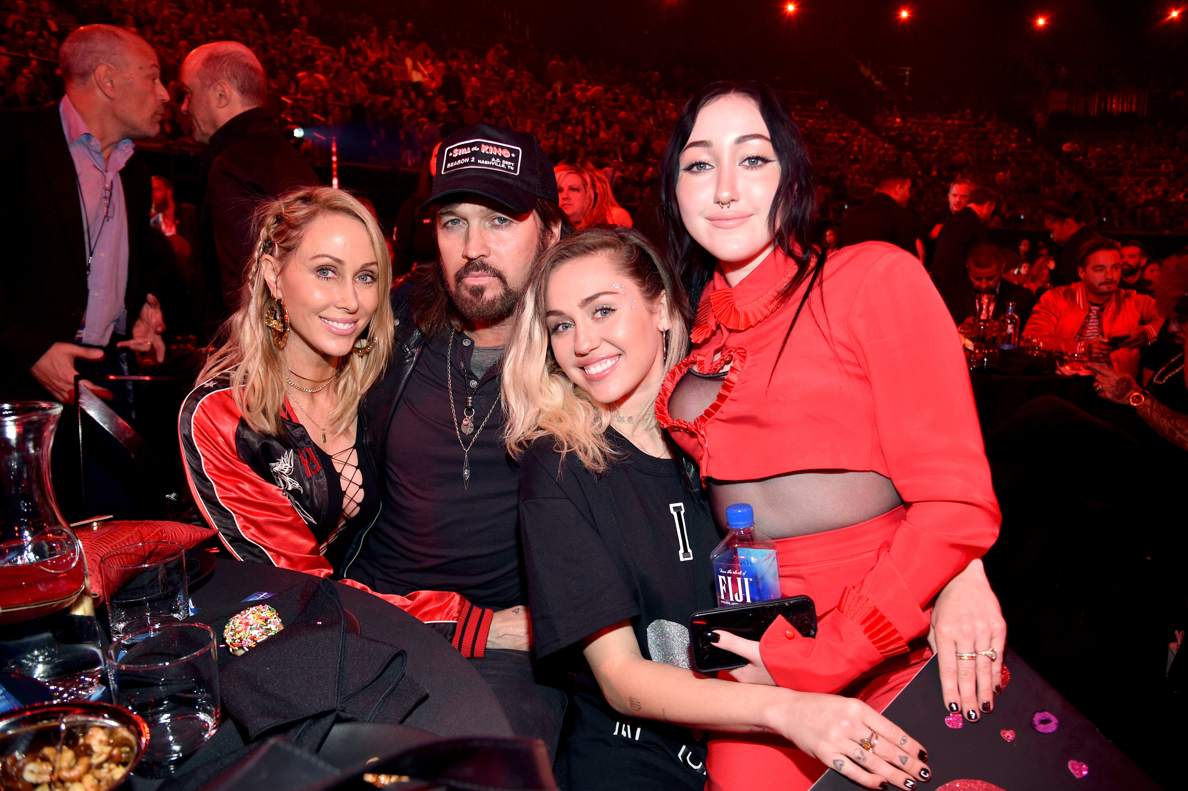 miley and her family at an event