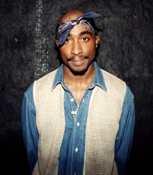 closeup of him in denim and a bandana on his head