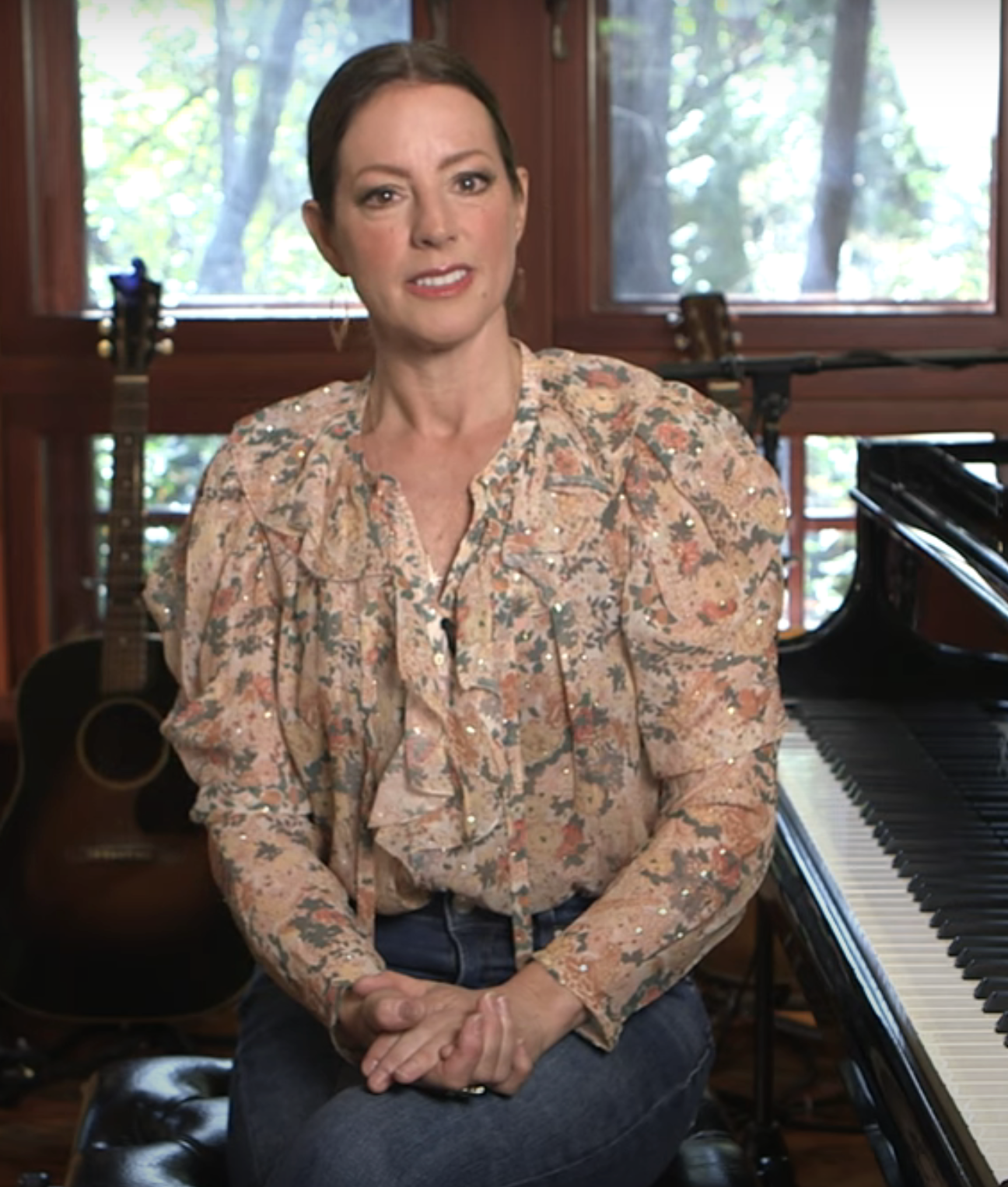 sarah sitting by her piano