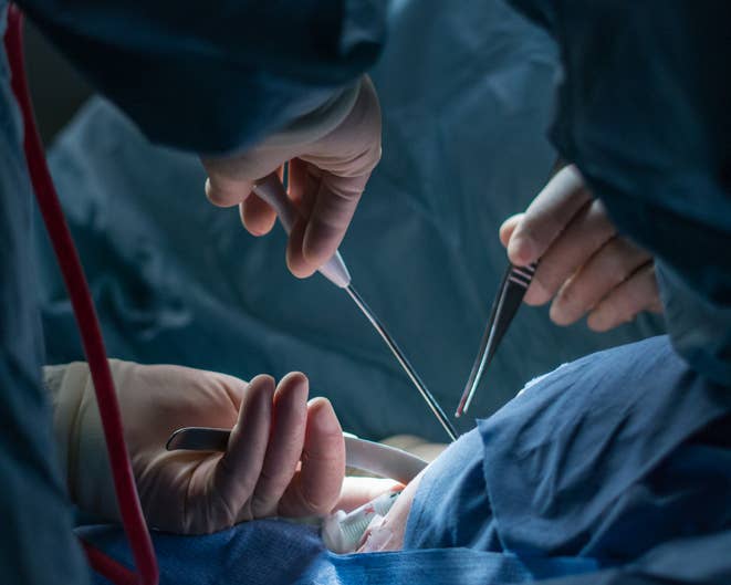 hands using tools during surgery