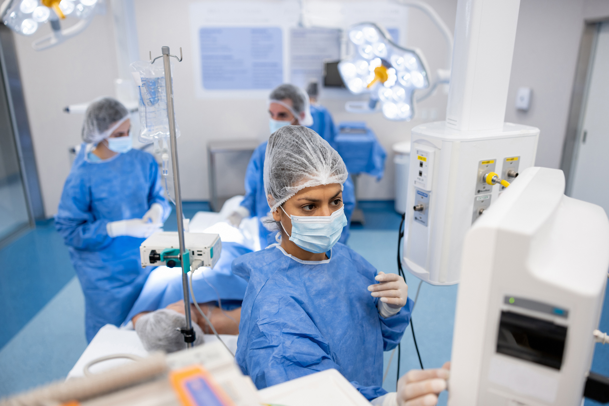 doctors in a surgery room with a patient