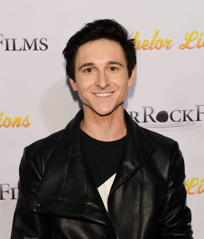 Closeup of Mitchel Musso smiling on the red carpet