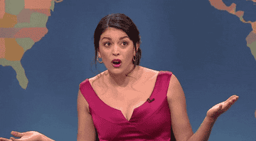 Cecily Strong shrugging in exasperation on Saturday Night Live&#x27;s &quot;Weekend Update&quot;