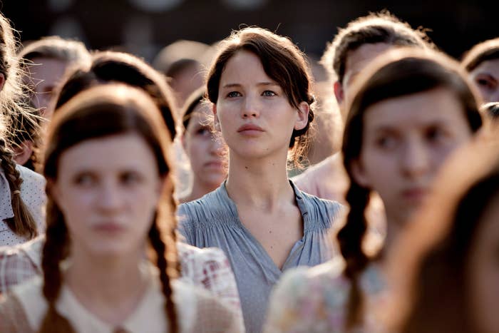 Katniss standing among the crowd from &quot;The Hunger Games&quot;