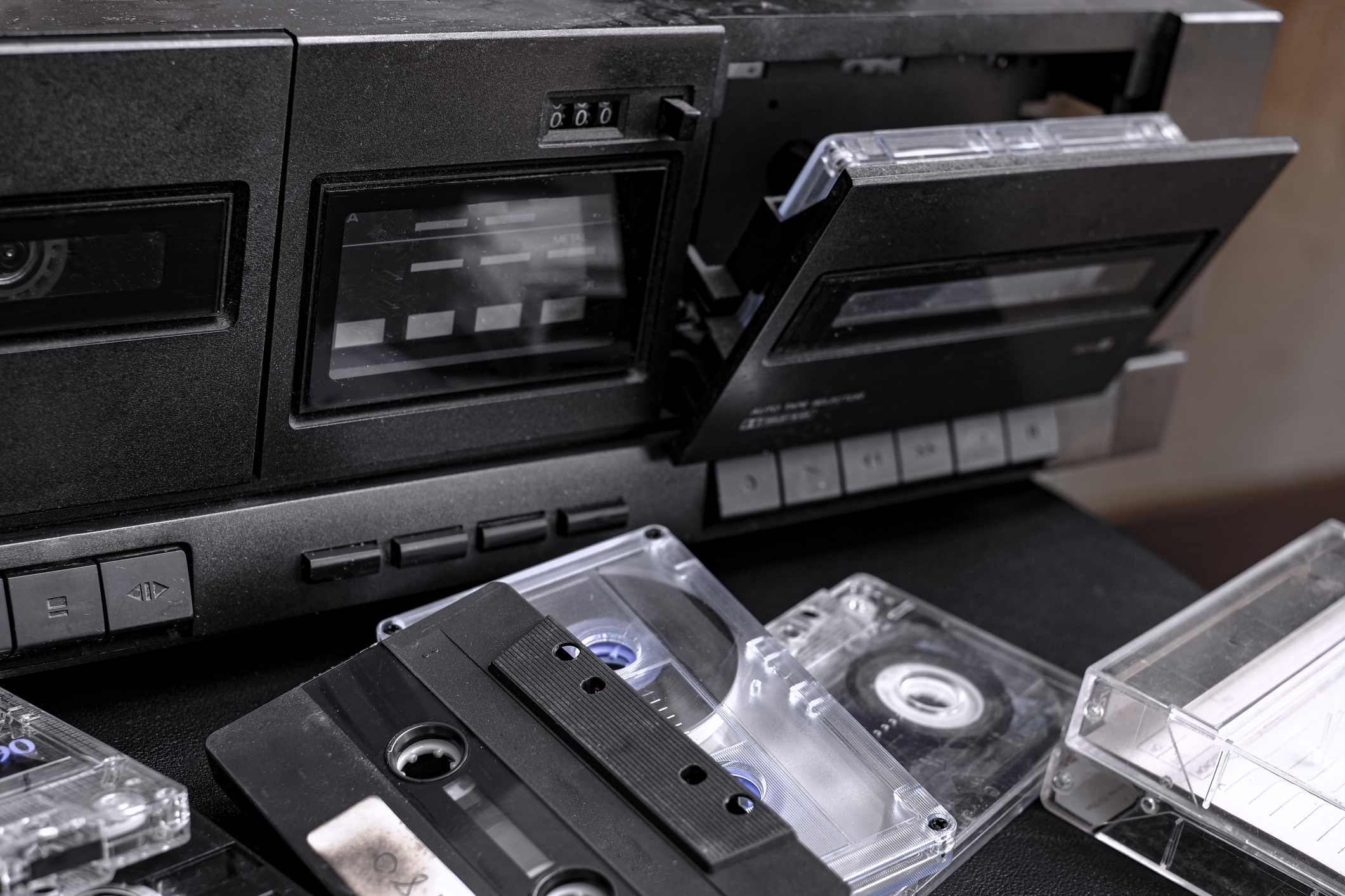 Cassette tapes next to a boombox