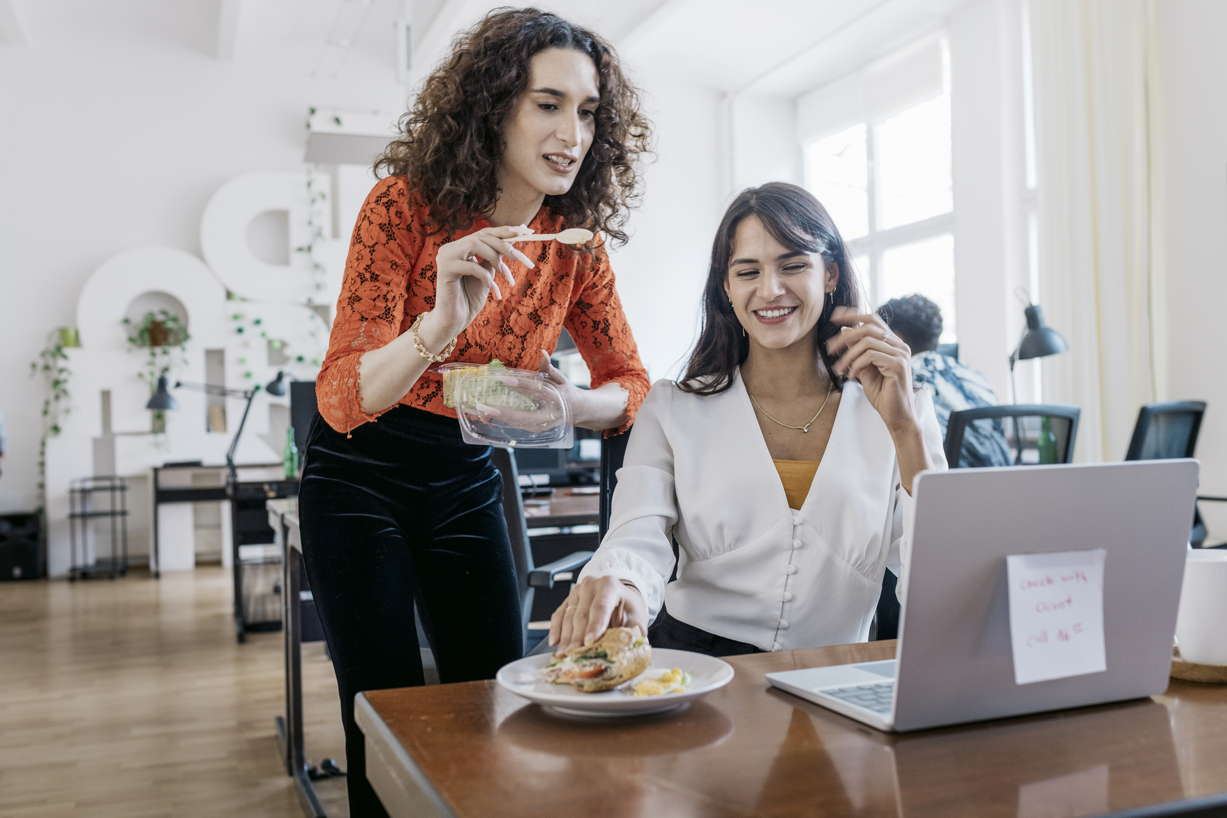 young people chatting in an office