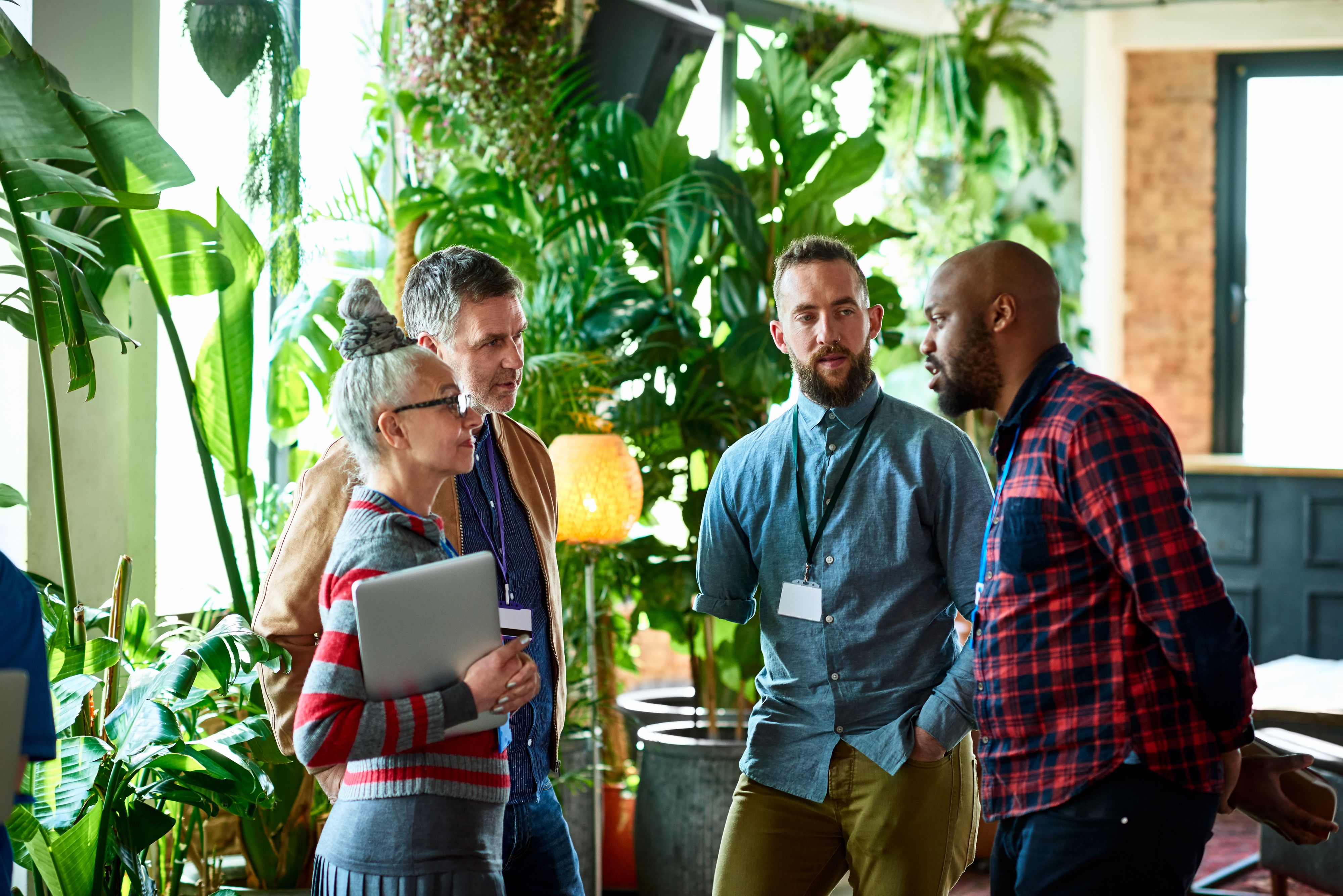 diverse group of colleagues having a standup meeting