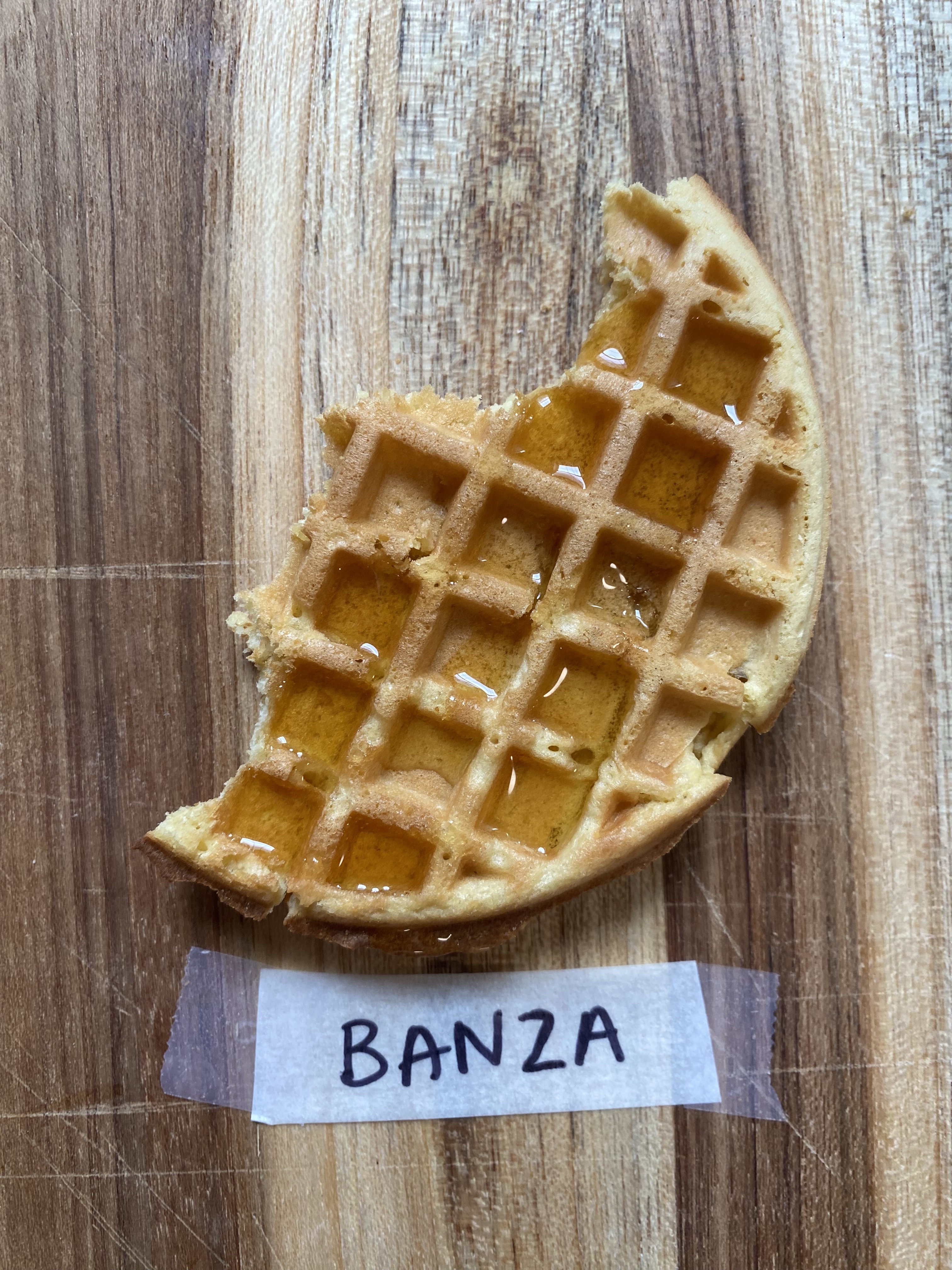a banza waffle with maple syrup