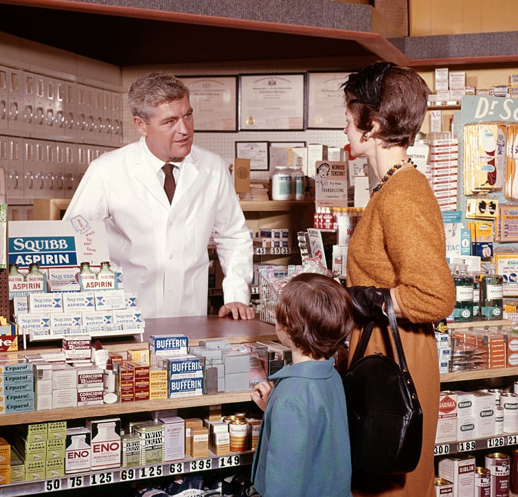 A parent with their kid at a pharmacy