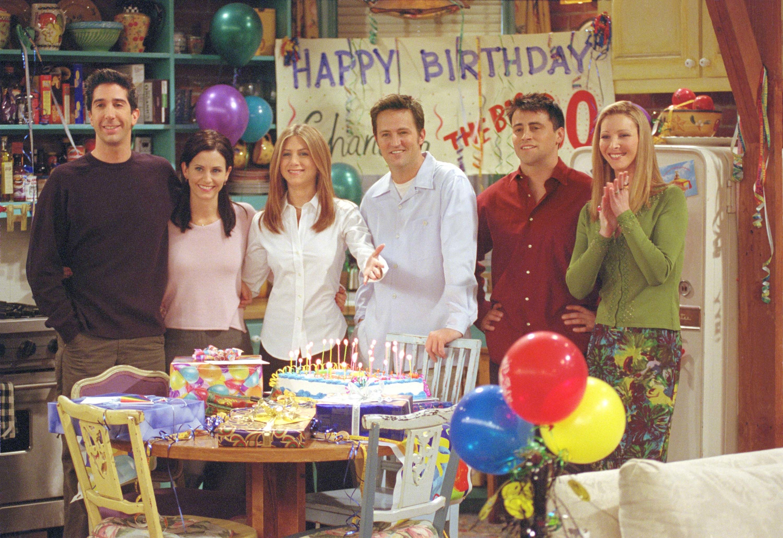 The six leads at a birthday party on the show