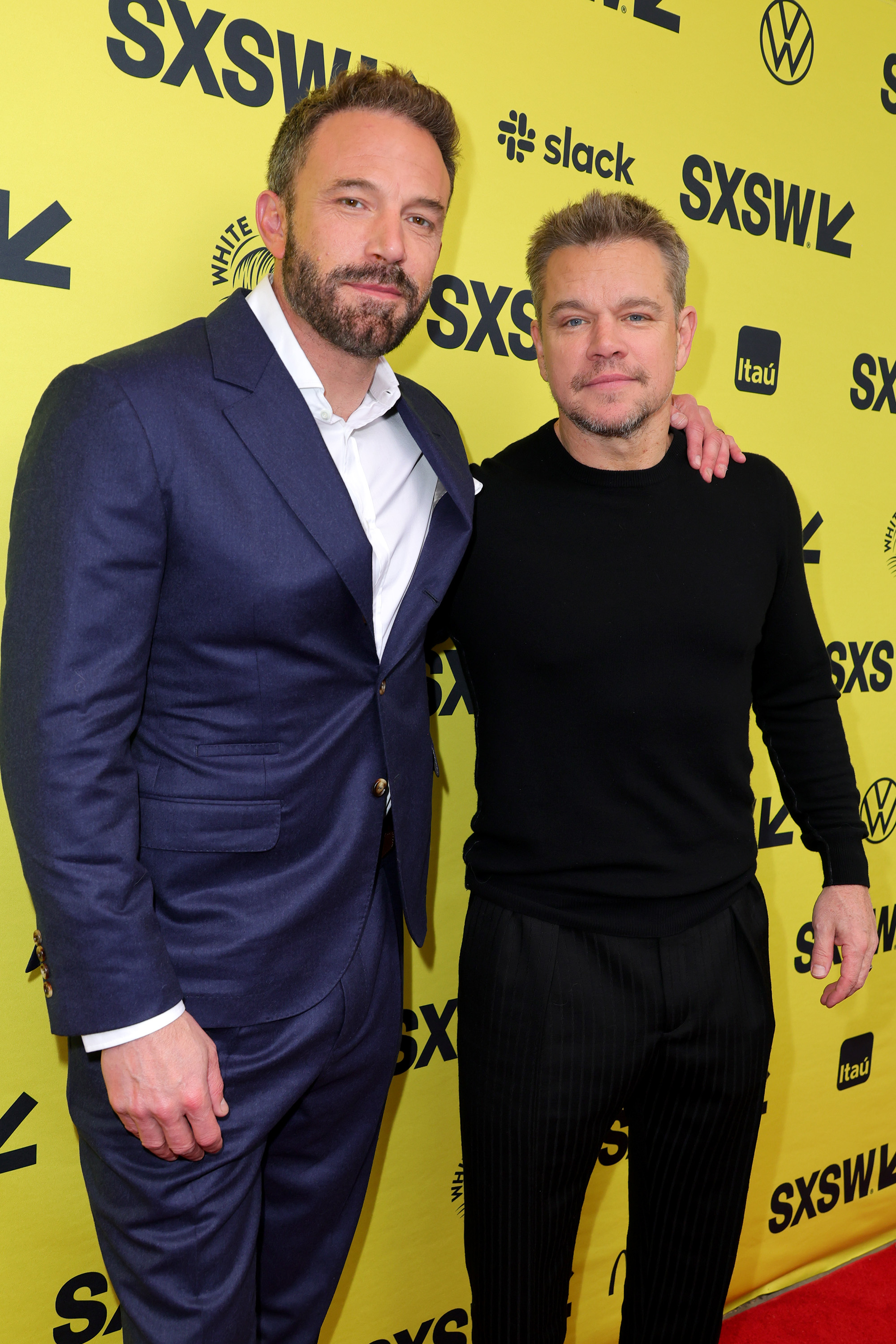 Close-up of Ben and Matt standing together at a media event