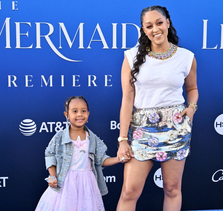 Tia with her daughter on the little mermaid red carpet