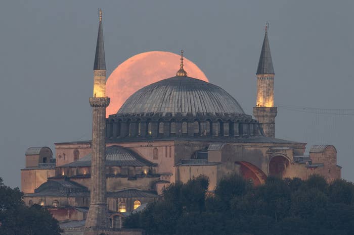 The blue supermoon is seen behind Hagia Sophia mosque in Istanbul, Turkey