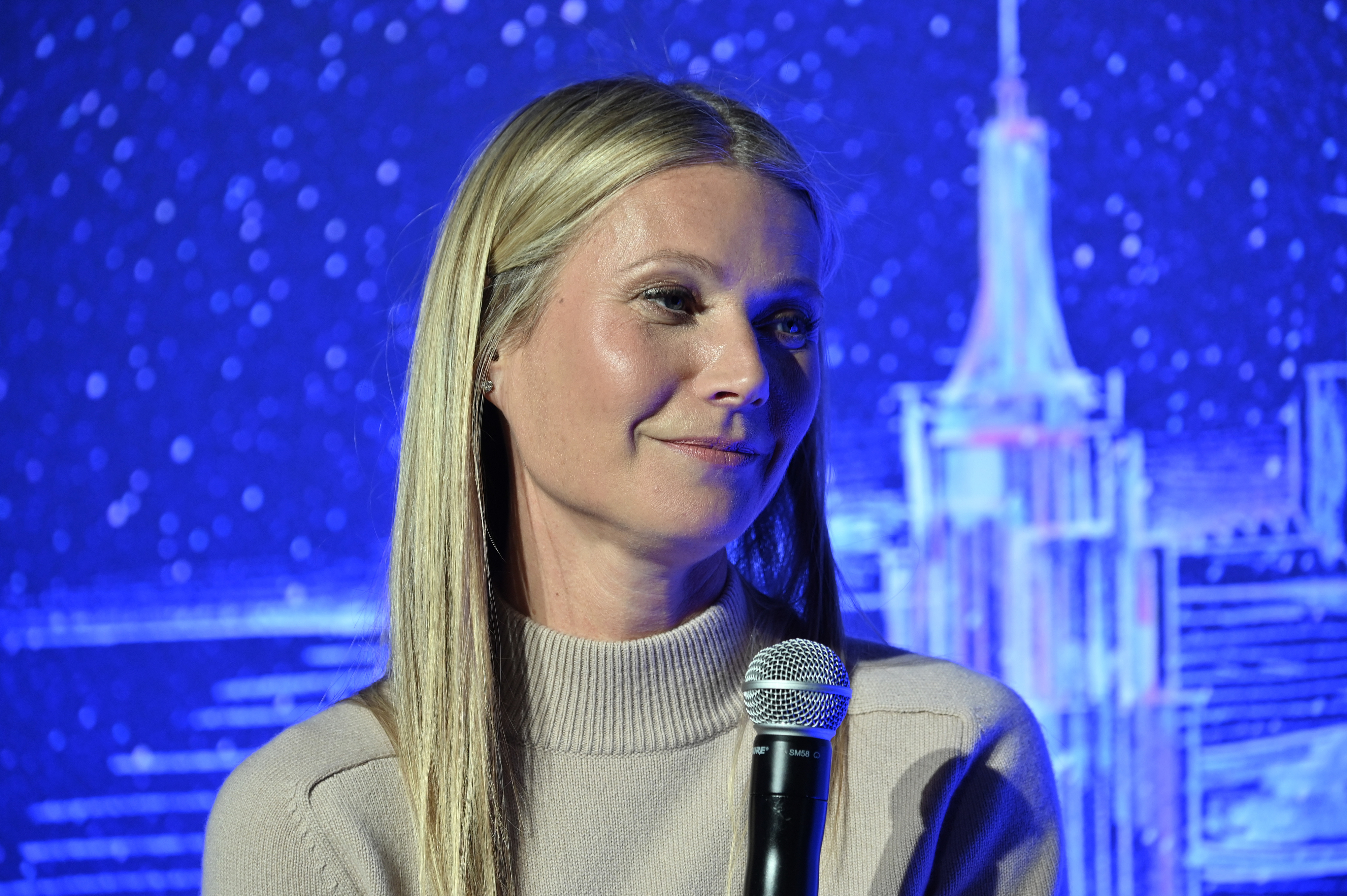 Close-up of Gwyneth holding a microphone