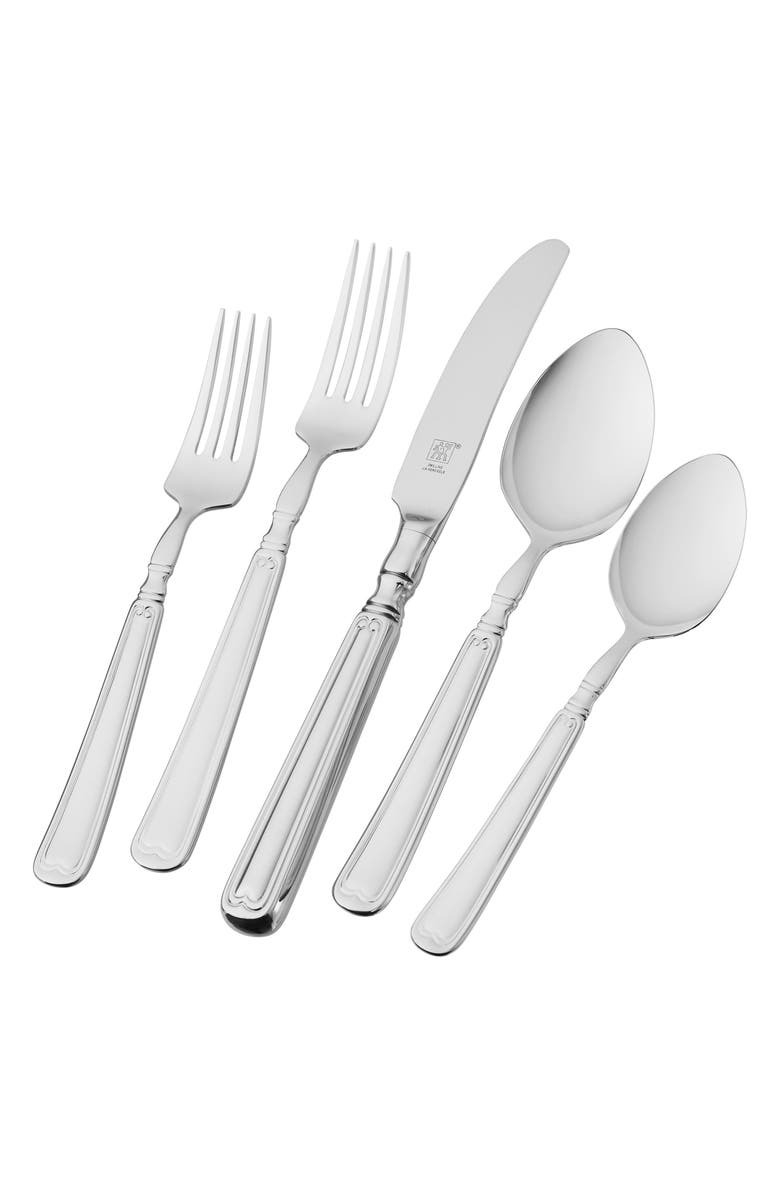 two forks, a butter knife, and two spoons from the flatware set