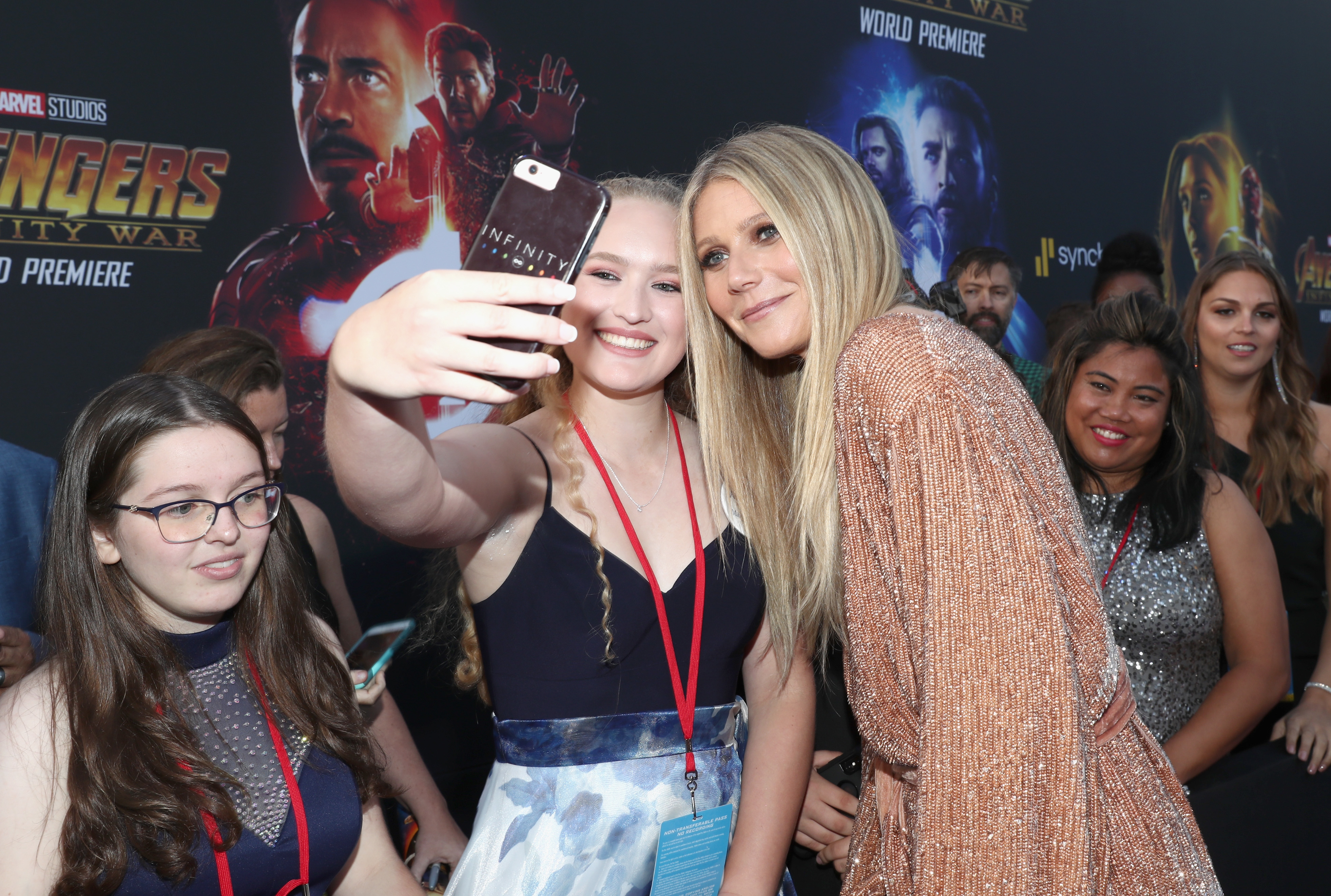 Close-up of Gwyneth taking a selfie with fans at a Marvel event