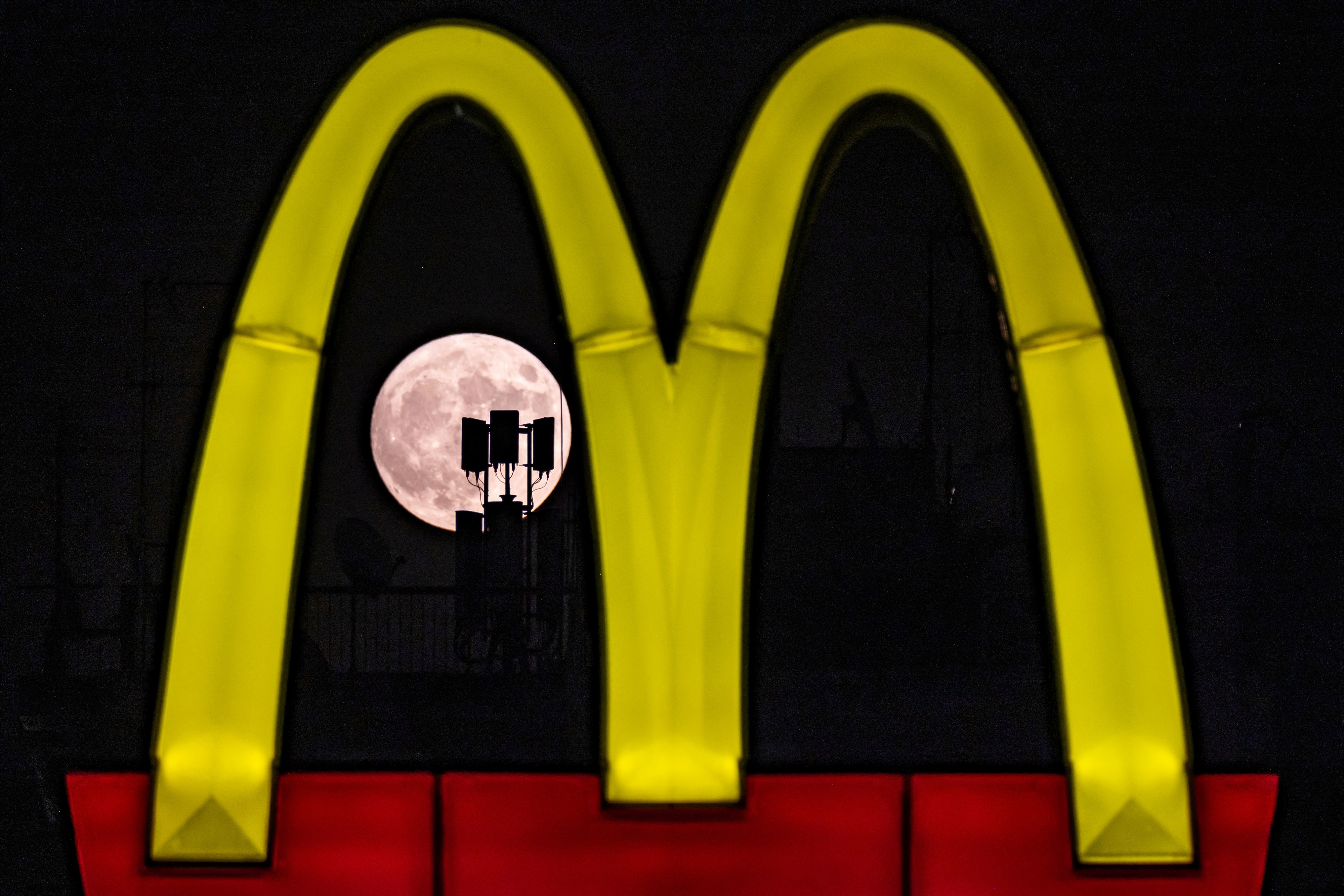 The blue supermoon is seen behind a McDonald&#x27;s sign in Nicosia, Cyprus