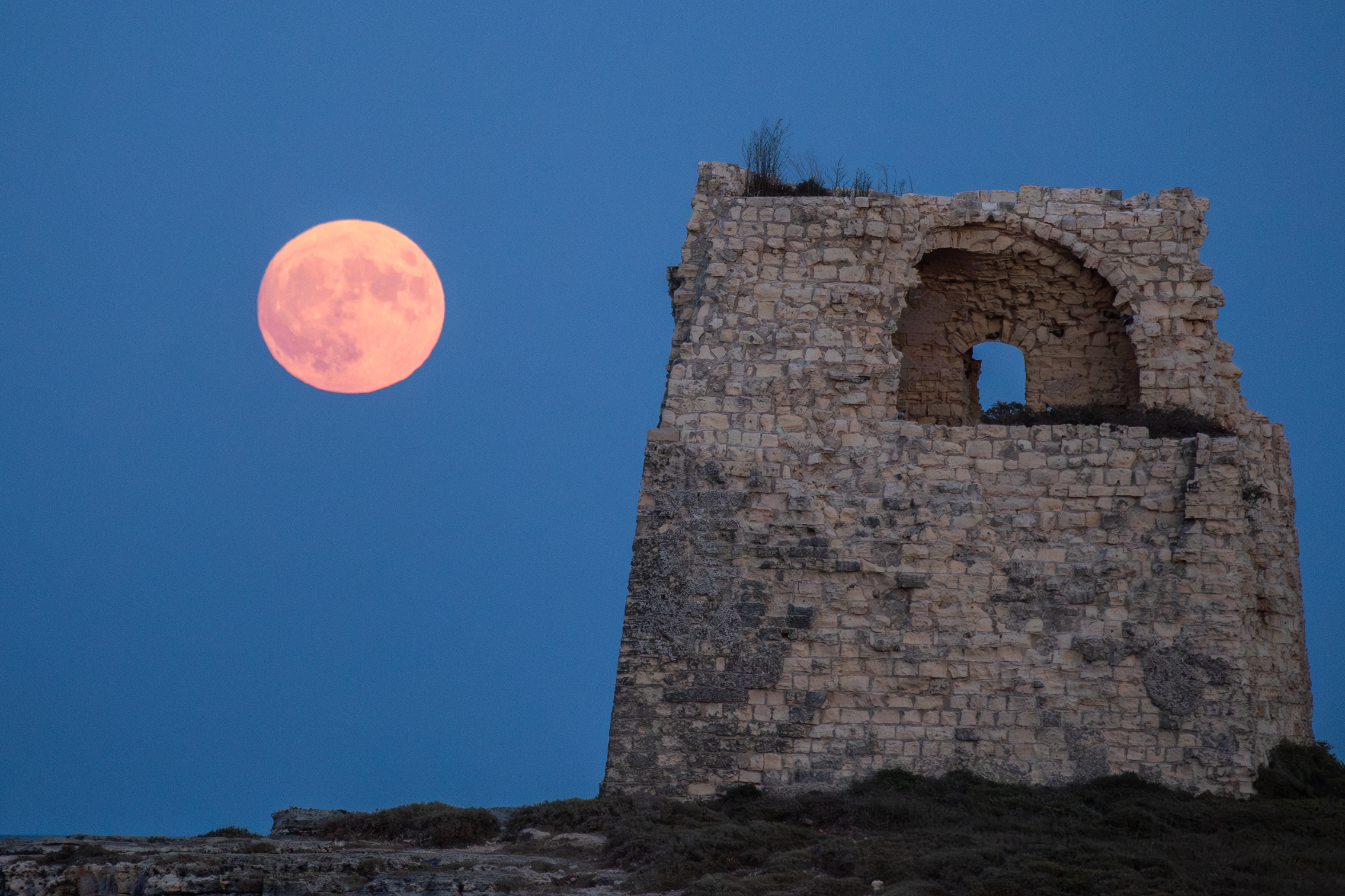 The blue supermoon is seen in Lecce, Italy