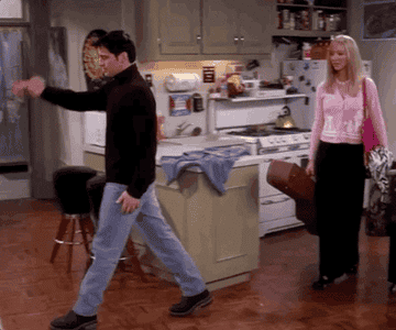 joey showing phoebe the pizza and napkin on the floor