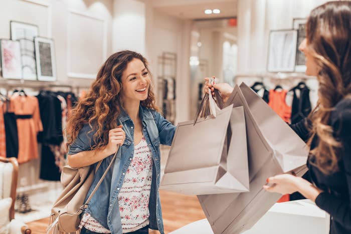 person with a lot of shopping bags